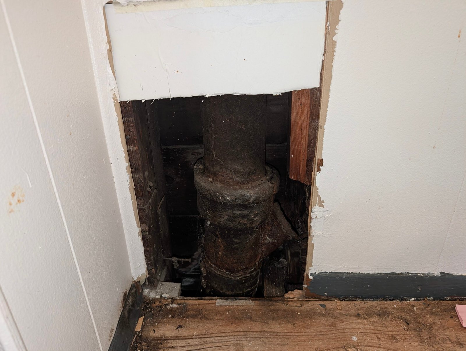Damaged cast iron plumbing piping requiring repair
